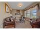Cozy living room featuring neutral walls, and a large window at 8655 E 130Th Ave, Thornton, CO 80602