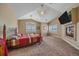 Main bedroom featuring a fireplace, vaulted ceiling, and ample natural light at 8655 E 130Th Ave, Thornton, CO 80602