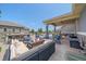 Inviting outdoor living space with a fire pit, comfortable seating, and an outdoor bar area at 8655 E 130Th Ave, Thornton, CO 80602