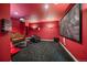 Theater room featuring comfortable seating and a large projector screen for the ultimate viewing experience at 8655 E 130Th Ave, Thornton, CO 80602