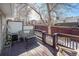 A cozy back porch with seating, a view of the backyard and air conditioning at 5252 W 68Th Ave, Arvada, CO 80003