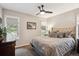 Cozy bedroom with neutral tones, soft lighting, and comfortable bed at 7312 Marshall Rd, Larkspur, CO 80118