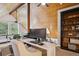 Bright office features natural wood vaulted ceilings, workstation, and custom built in shelving at 7312 Marshall Rd, Larkspur, CO 80118