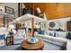 Inviting living room with vaulted ceilings, modern staircase, and comfortable seating arrangement at 7312 Marshall Rd, Larkspur, CO 80118
