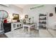 Inviting home office featuring a modern desk, comfortable seating, and a bright window showcasing outdoor views at 7312 Marshall Rd, Larkspur, CO 80118