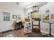 Bright art studio with ample natural light, an easel with a canvas, and an array of art supplies and equipment at 7312 Marshall Rd, Larkspur, CO 80118