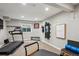 Basement workout room with treadmill, weight bench and bright natural light from the window at 7312 Marshall Rd, Larkspur, CO 80118
