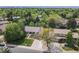 Aerial view of the home nestled among lush trees and landscaped yard with mature landscaping at 3775 S Poplar St, Denver, CO 80237