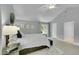 Bright bedroom features large windows, vaulted ceiling, and neutral decor at 3775 S Poplar St, Denver, CO 80237