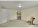 Neutral bedroom with an oversized closet and a rocking chair at 3775 S Poplar St, Denver, CO 80237