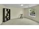 Neutral bedroom with a dark bookcase and a rocking chair at 3775 S Poplar St, Denver, CO 80237