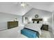 Spacious primary bedroom featuring neutral paint, vaulted ceilings, and natural lighting at 3775 S Poplar St, Denver, CO 80237