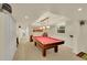 Spacious game room with a pool table and neutral carpeting at 3775 S Poplar St, Denver, CO 80237