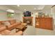 Cozy living room with a fireplace and views to the backyard at 3775 S Poplar St, Denver, CO 80237