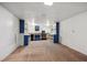 Basement offering carpet flooring, cabinets and shelves, and window at 3871 W Saratoga Ave, Littleton, CO 80123