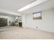 Basement with fireplace and a separate sitting area at 3871 W Saratoga Ave, Littleton, CO 80123