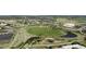 Scenic aerial view of neighborhood with park, green space, and walking paths nearby at 652 Ulster Way, Denver, CO 80230