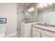 Modern bathroom features a tiled shower and granite countertop at 652 Ulster Way, Denver, CO 80230