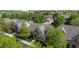 Charming home with a stone and siding exterior, lush landscaping, and mature trees at 652 Ulster Way, Denver, CO 80230