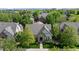 Attractive home boasts a stone and siding exterior, well-manicured lawn, and mature trees at 652 Ulster Way, Denver, CO 80230