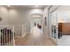 Hallway with natural light leading to the living spaces at 652 Ulster Way, Denver, CO 80230