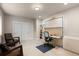 Bright home office with built-in desk, shelving, and two comfortable chairs at 652 Ulster Way, Denver, CO 80230