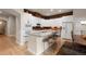 Well-equipped kitchen with counter seating and a spacious island, perfect for casual dining and socializing at 652 Ulster Way, Denver, CO 80230