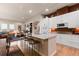 Well-equipped kitchen with counter seating and a spacious island, perfect for casual dining and socializing at 652 Ulster Way, Denver, CO 80230