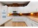 Bright kitchen with modern appliances, ample counter space, and cabinets for storage at 652 Ulster Way, Denver, CO 80230