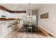 Spacious kitchen, featuring stainless steel appliances and a dining area, perfect for entertaining guests at 652 Ulster Way, Denver, CO 80230