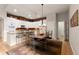 Well-lit kitchen and breakfast bar seating offering a casual dining experience at 652 Ulster Way, Denver, CO 80230