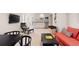 Recreation room with sofas and kitchenette for cozy entertaining at 652 Ulster Way, Denver, CO 80230