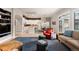 Spacious living area showcasing an open floor plan with hardwood floors, abundant natural light, and modern decor at 652 Ulster Way, Denver, CO 80230