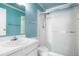 Bathroom featuring a shower with glass doors and a vanity with sink at 16035 E Ithaca Pl # D, Aurora, CO 80013