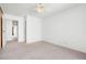 Bedroom featuring neutral carpet, ceiling fan, and ample natural light at 16035 E Ithaca Pl # D, Aurora, CO 80013