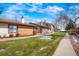 Exterior view of the homes with well-maintained landscaping and walkways at 16035 E Ithaca Pl # D, Aurora, CO 80013