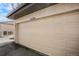 Garage door with house number and attached carport at 16035 E Ithaca Pl # D, Aurora, CO 80013