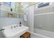 Clean bathroom features a classic white sink, bathtub, and tiled walls at 1435 Vine St # 2, Denver, CO 80206