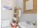 Charming bathroom with ladder shelving and a vintage sink, creating a cozy and functional space at 1435 Vine St # 2, Denver, CO 80206