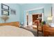 Bright and airy bedroom leading to a cozy sitting room and en-suite bathroom, offering comfort and privacy at 1435 Vine St # 2, Denver, CO 80206