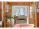 Inviting bedroom view through French doors, showcasing a comfortable queen bed and bright, airy space at 1435 Vine St # 2, Denver, CO 80206