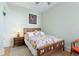 This inviting bedroom features a wooden bed frame and a colorful floral comforter at 1435 Vine St # 2, Denver, CO 80206