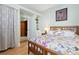This cozy bedroom is light and airy, with warm wood flooring and a large, comfy bed at 1435 Vine St # 2, Denver, CO 80206