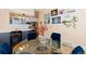 Bright dining area with a glass table, art displays, and seamless flow into the adjacent kitchen space at 1435 Vine St # 2, Denver, CO 80206