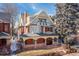 Beautiful exterior view of a charming multi-story home with a lovely porch and classic architectural details at 1435 Vine St # 2, Denver, CO 80206