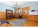 Entryway with hardwood floors, classic wooden fireplace, and vintage light fixture at 1435 Vine St # 2, Denver, CO 80206