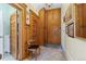 Hallway featuring wooden doors and trim, a comfortable chair, and decorative accents at 1435 Vine St # 2, Denver, CO 80206