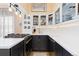Well-appointed kitchen with gas range, stylish cabinetry, white countertops and subway tile backsplash at 1435 Vine St # 2, Denver, CO 80206
