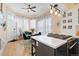 Sun-drenched kitchen nook featuring a glass table, floral curtains and a modern island with gas cooktop at 1435 Vine St # 2, Denver, CO 80206