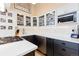 Updated kitchen with stainless steel appliances, white countertops and abundant cabinet space with glass fronts at 1435 Vine St # 2, Denver, CO 80206
